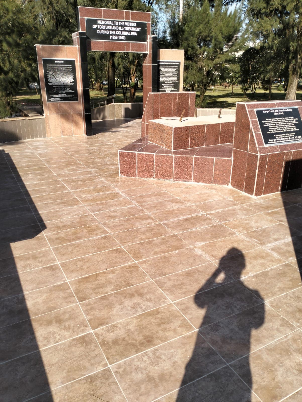 The re-paved memorial plaza looking towards the arch and the Kenya Land and Freedom Army plinth