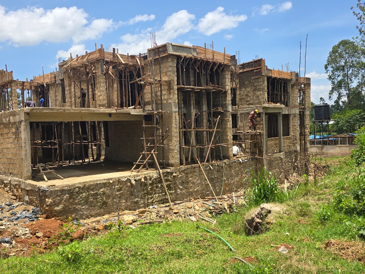 Ground-floor concrete-block walls and reinforced-concrete frame with timber propping